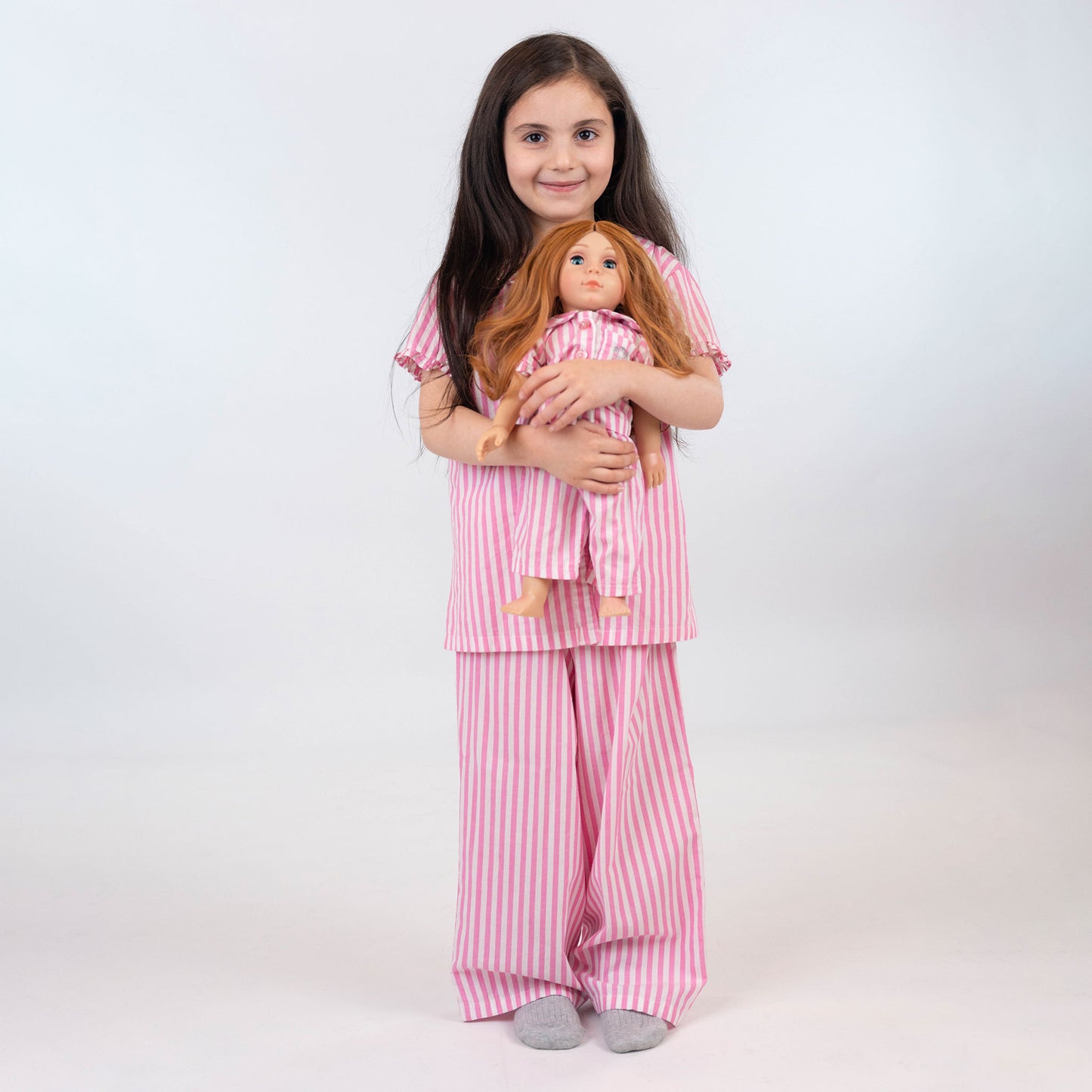 Girl and doll wearing Long pink and white pajamas by laftakids