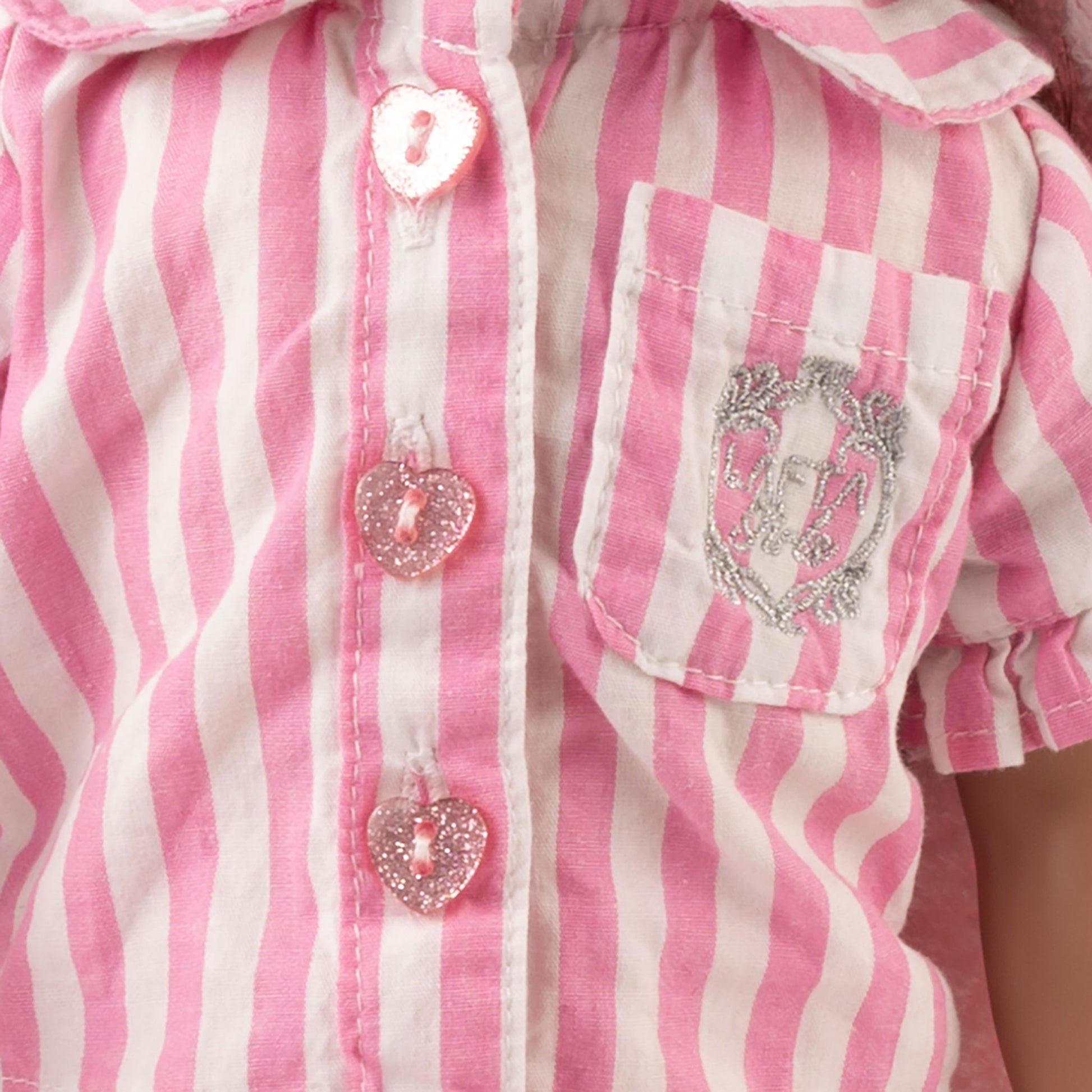 Close up of pink and white stripped pajama with LaftaKids logo embroidered  on front pocket of pajama